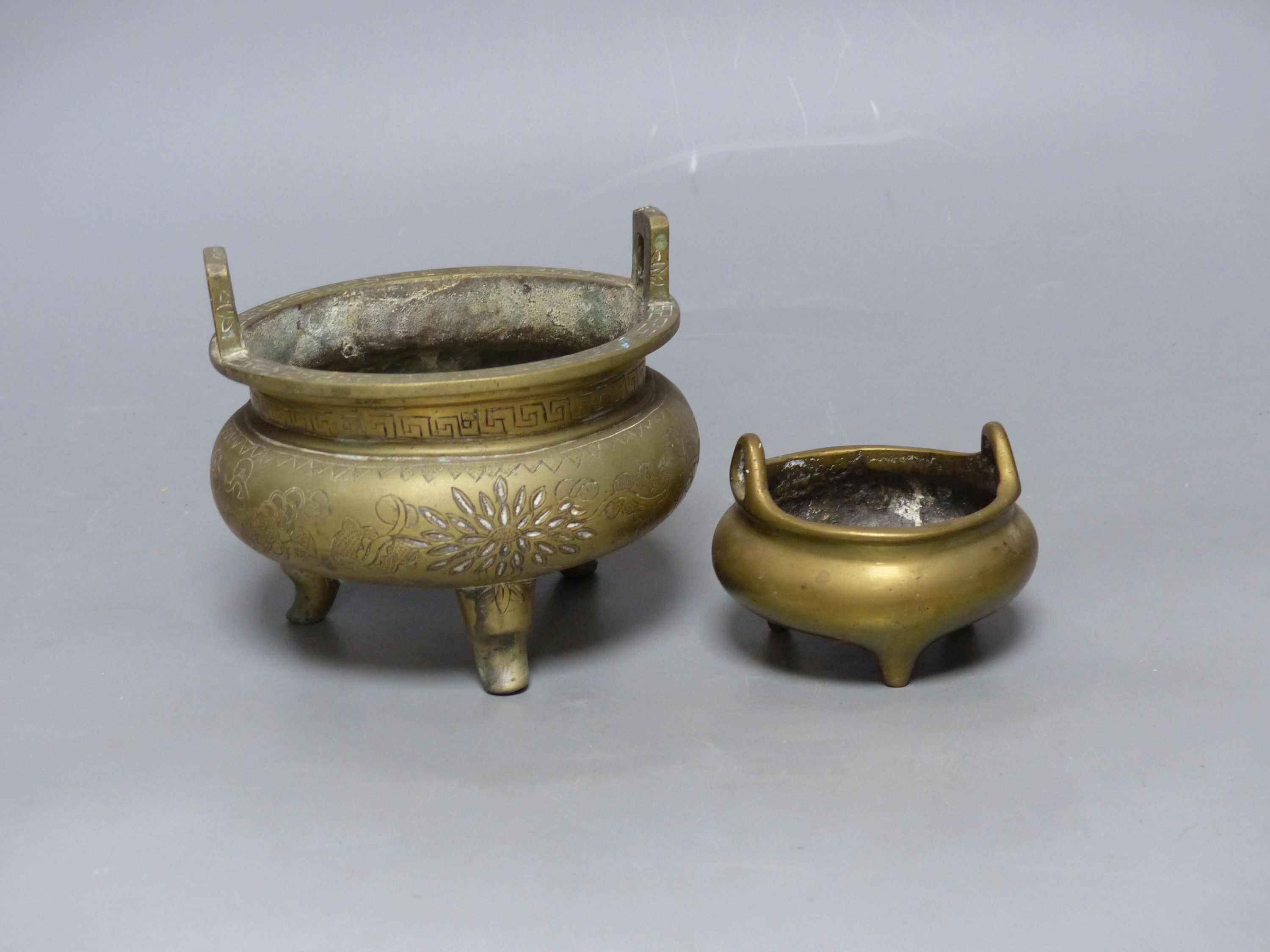 Two Chinese bronze tripod censers, Xuande marks, 19th/20th century, tallest overall 10cm